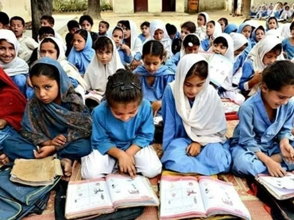 Children with backpacks arriving at a school gate in morning light